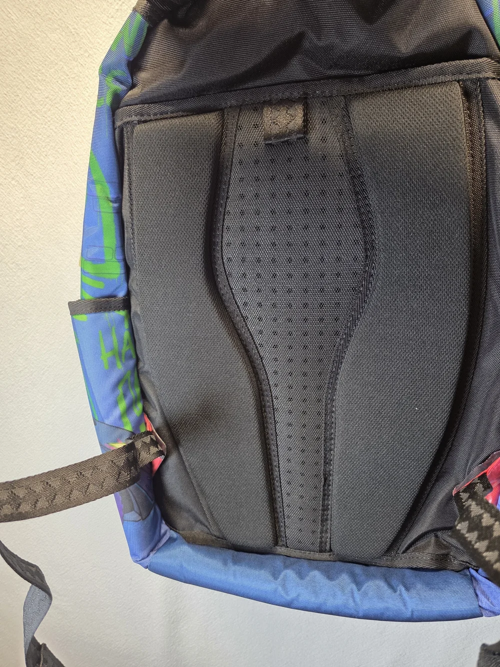 Sprayground DC Joker No Rules Backpack featuring a vibrant, graffiti-styled Bag